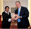 US Vice President Al Gore receives Through the Political Glass Ceiling by Dr Kris Rameprsad from Prime Minister Kamla Persad-Bissessar