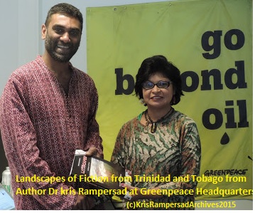 Head of Greenpeace Dr Kumi Naidoo receives a copy of LiTTscapes Landscapes of Fiction from Dr Kris Rampersad