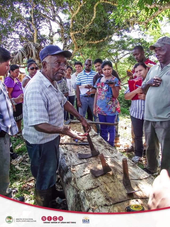 The traditional Woodcutter of Belize carves a canoe from a log Heritage Educator Dr Kris Rampersad conducts UNESCO Intangible Cultural Heritage Workshop in Belize